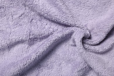 Texture of soft violet crumpled fabric as background, top view