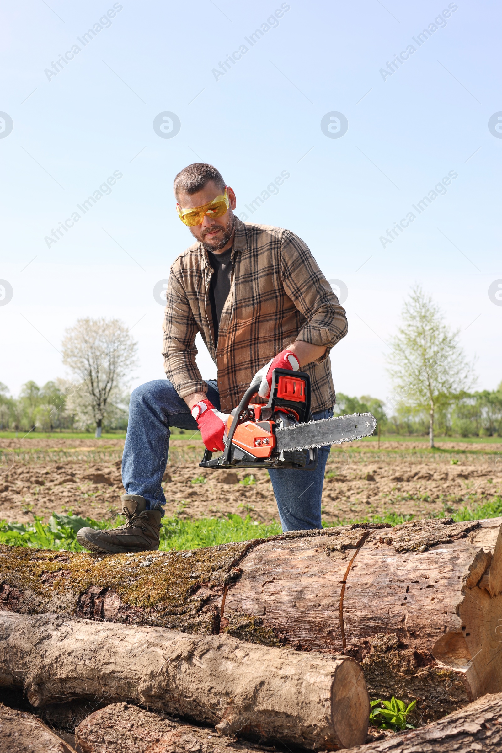 Photo of Man with modern saw on sunny day