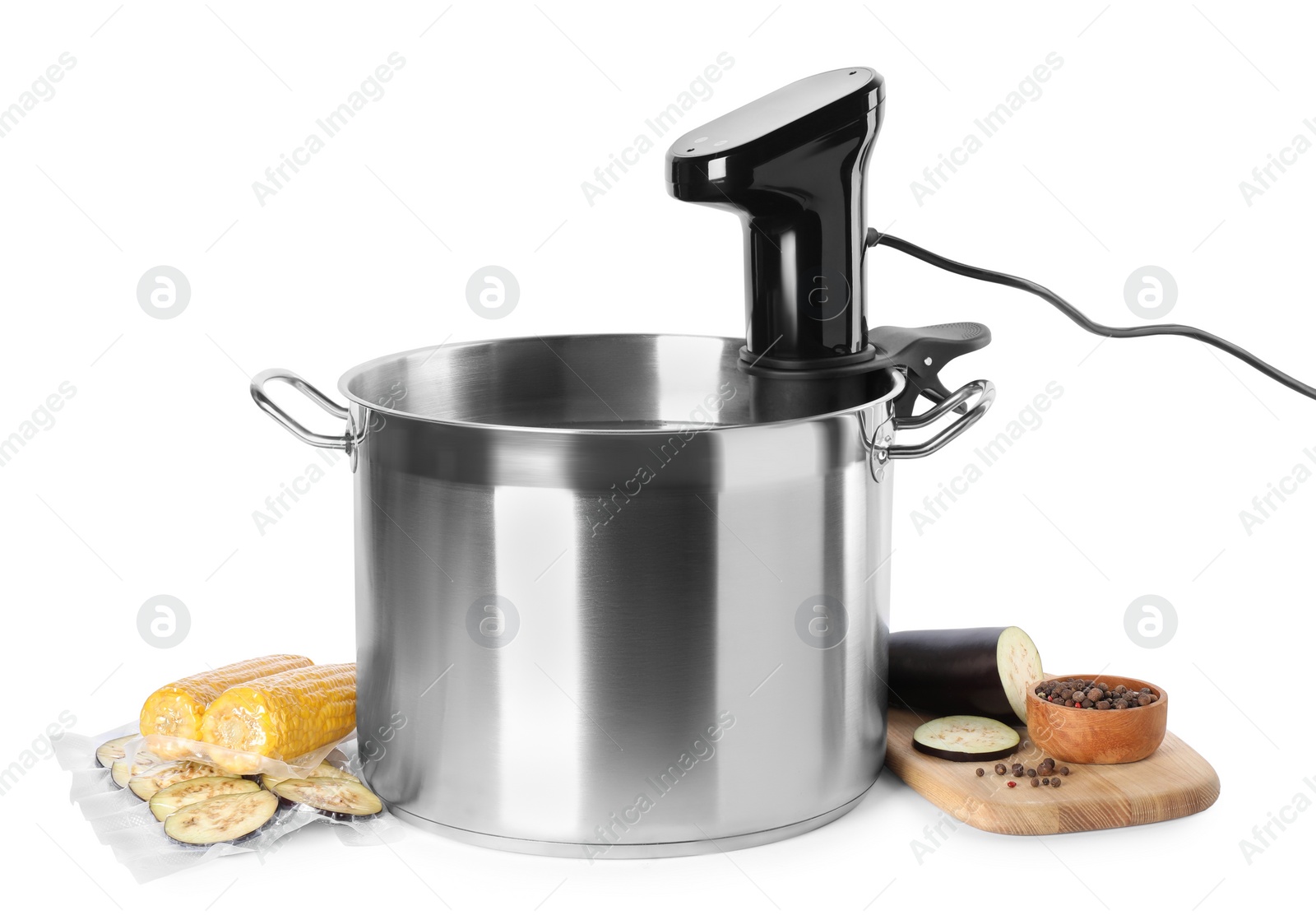 Photo of Thermal immersion circulator in pot and ingredients on white background. Sous vide cooking