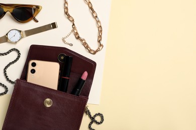 Photo of Flat lay composition with stylish woman's bag on color background. Space for text