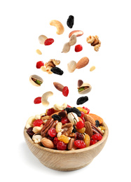 Image of Different nuts falling into bowl on white background 