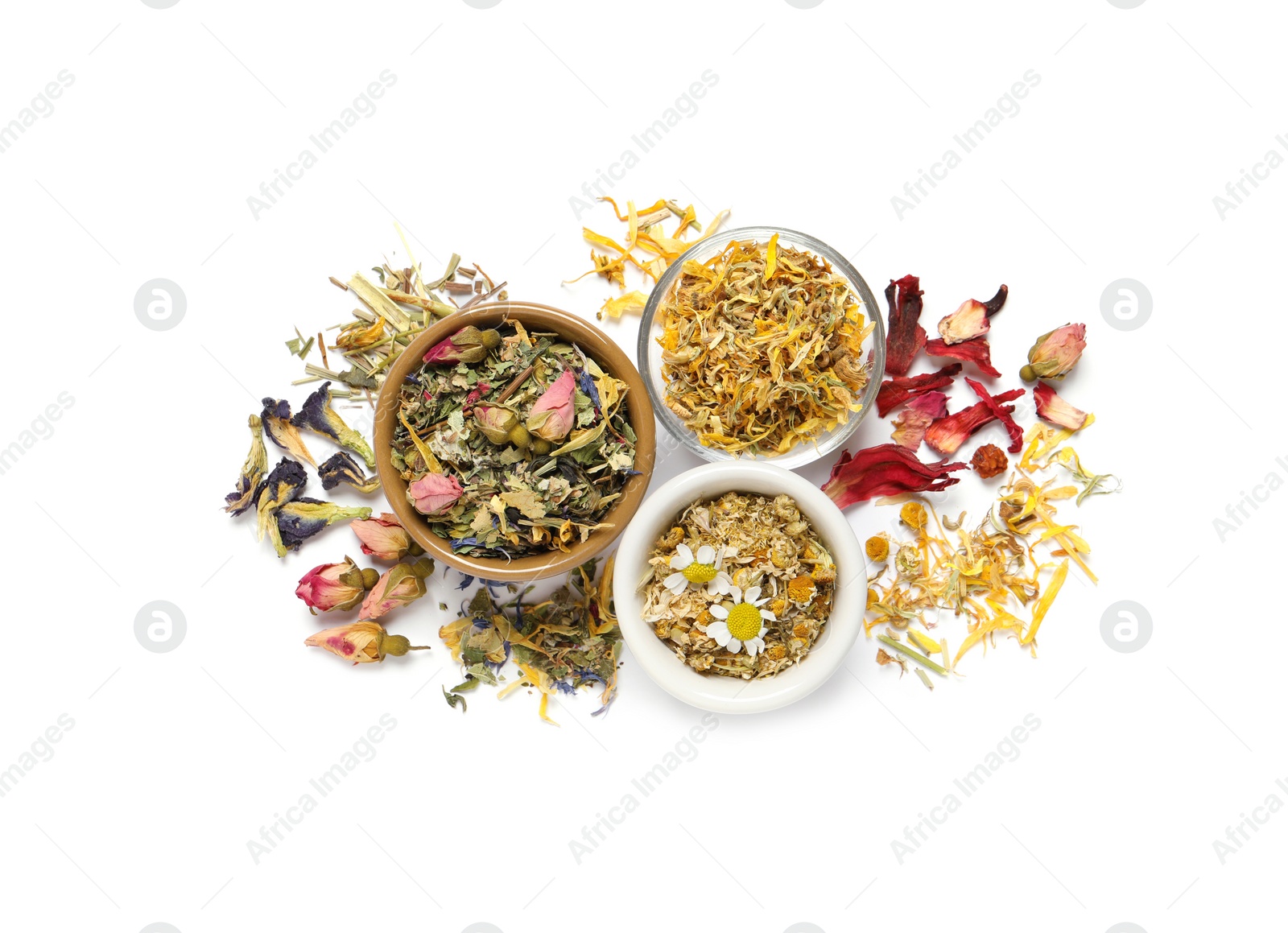 Photo of Different dry herbal teas on white background, top view