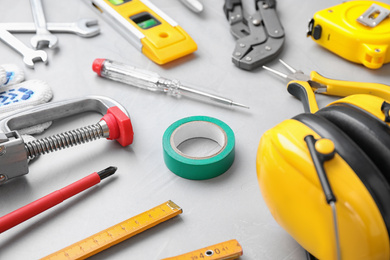 Different construction tools on light grey background