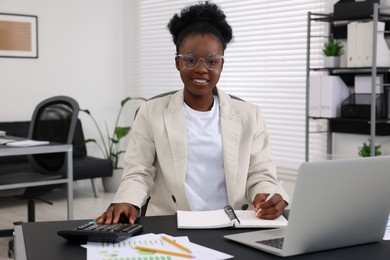 Professional accountant working at desk in office