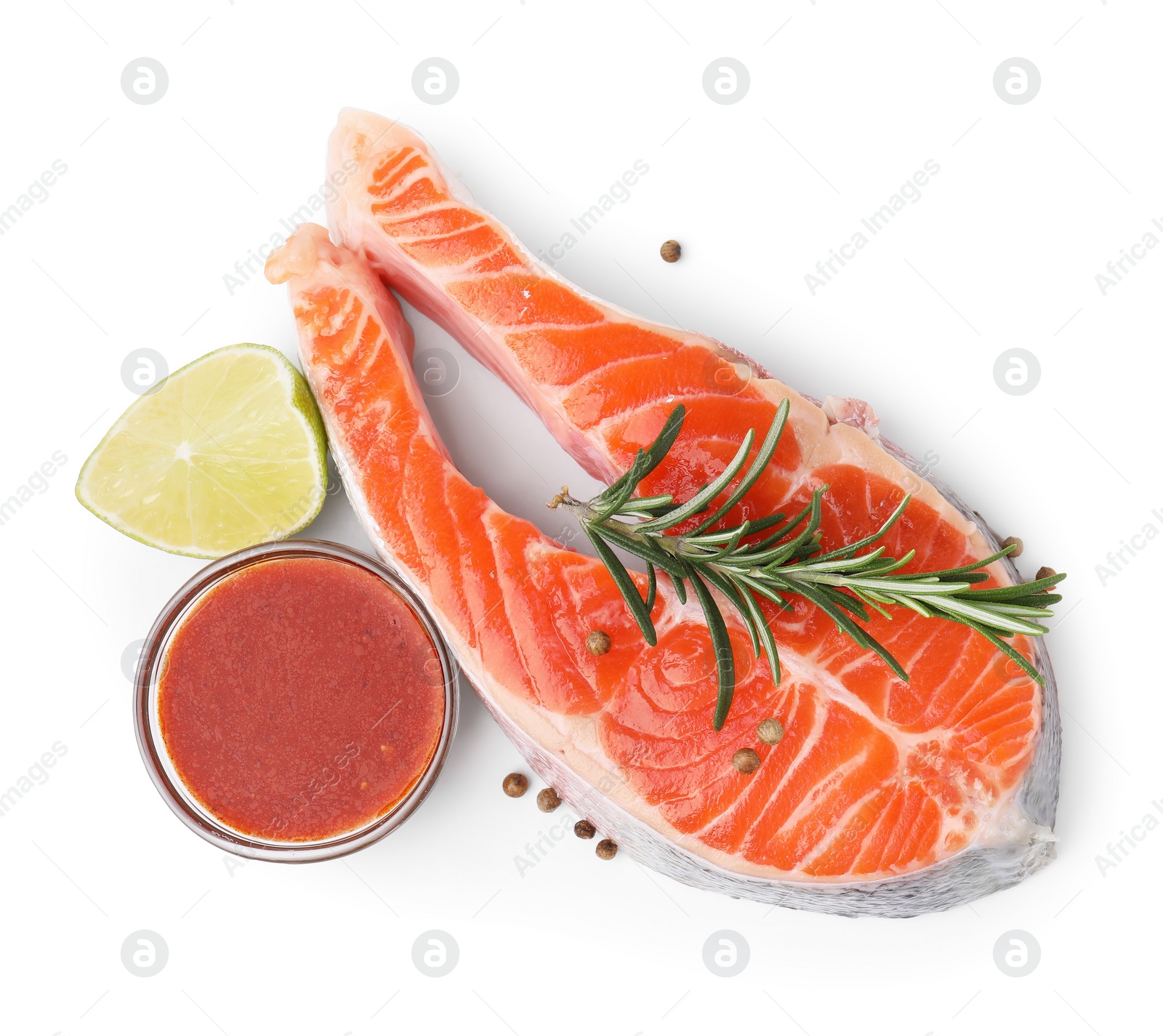 Photo of Fresh fish, lime, rosemary and marinade isolated on white, top view