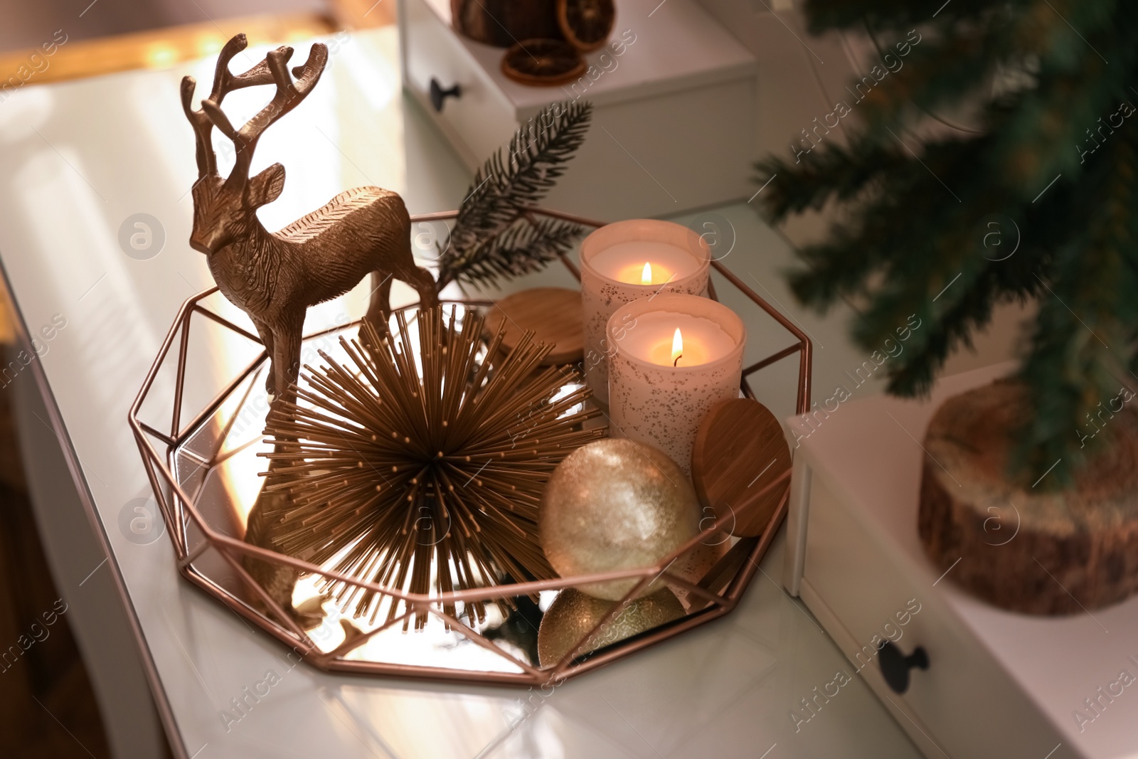 Photo of Composition with decorative reindeer and Christmas tree on dressing table, closeup