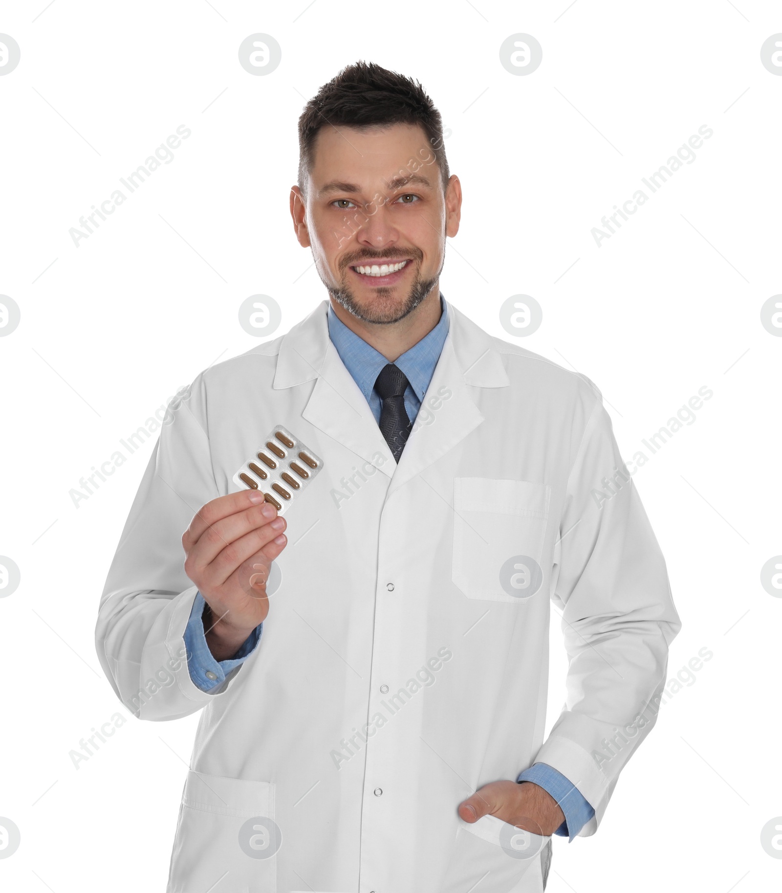 Photo of Professional pharmacist with pills on white background