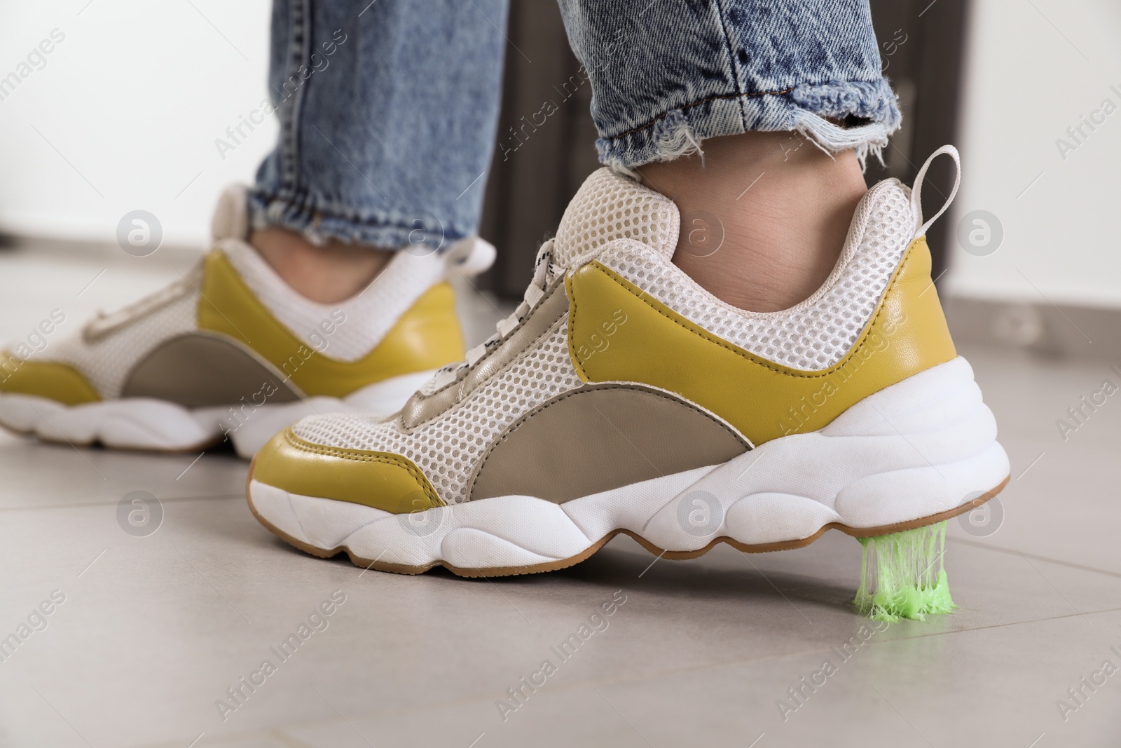 Photo of Person stepping into chewing gum on floor, closeup