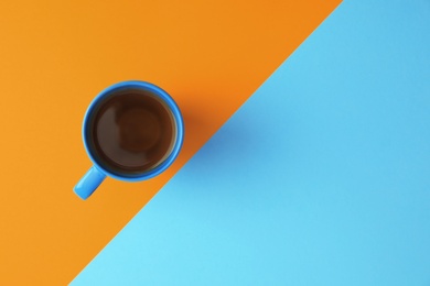 Photo of Cup of tea on color background, top view. Space for text