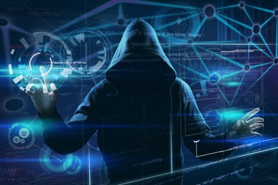 Man in hood and digital icons on dark background. Cyber attack concept