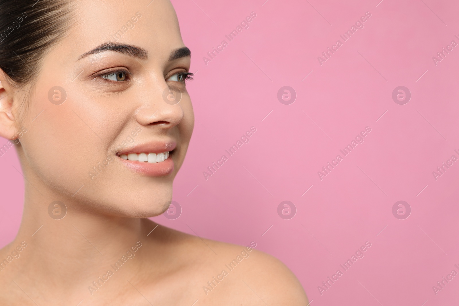 Photo of Portrait of young woman with beautiful face and natural makeup on color background, closeup. Space for text