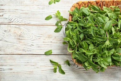 Tray with fresh mint on table, top view