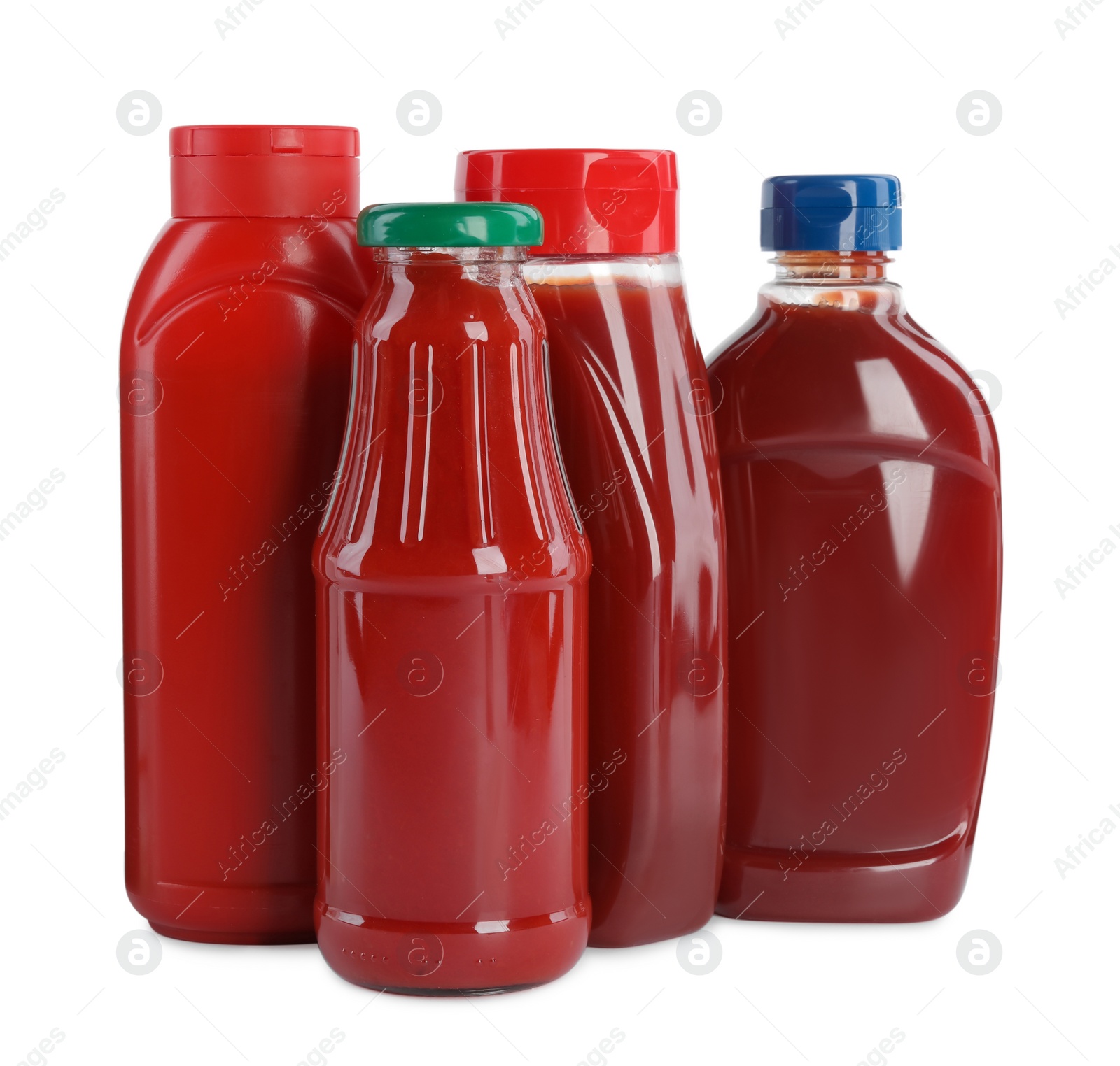 Photo of Different bottles of ketchup on white background