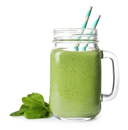 Mason jar of healthy green smoothie with fresh spinach on white background