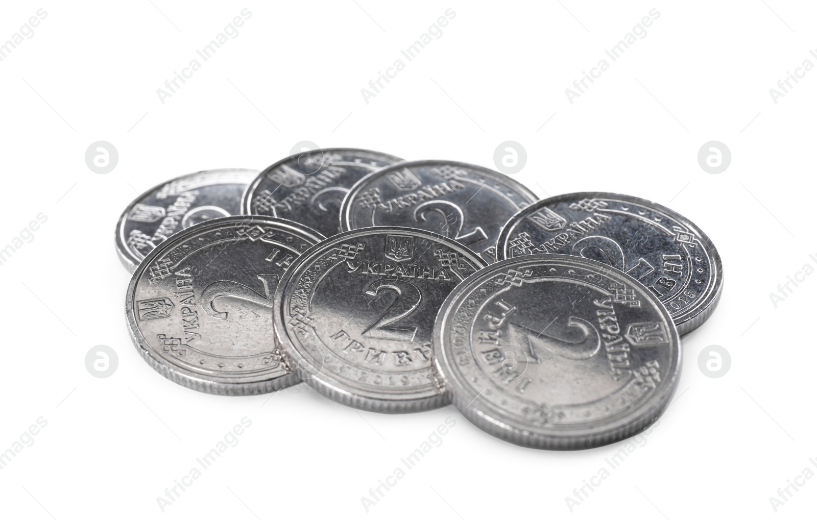 Photo of Many Ukrainian coins on white background. National currency