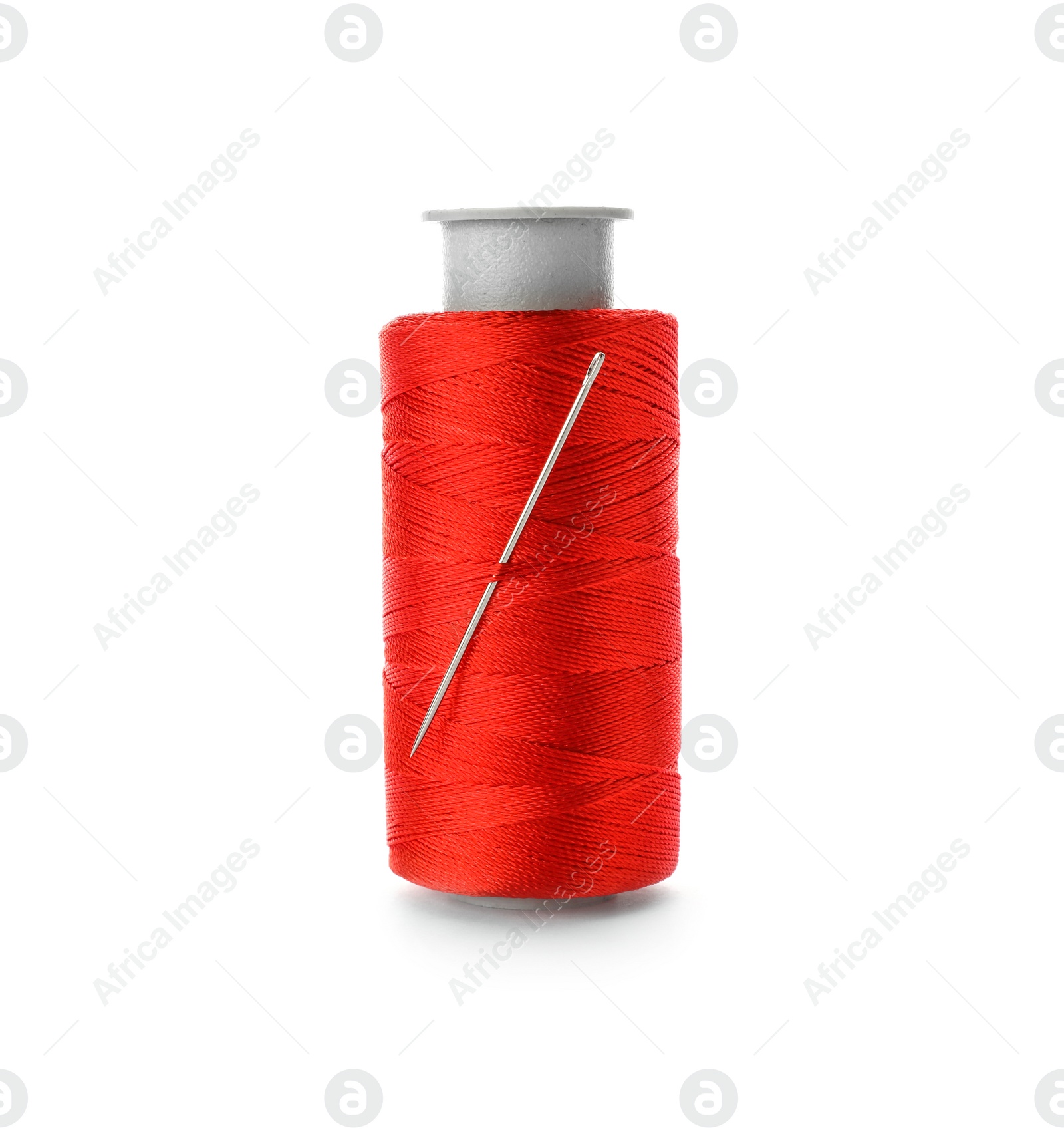 Photo of Color sewing thread with needle on white background