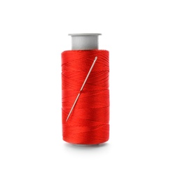 Photo of Color sewing thread with needle on white background