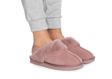 Photo of Woman in warm soft slippers on white background, closeup