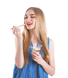 Young woman with yogurt on white background