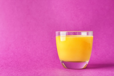 Photo of Glass with delicious detox smoothie on color background