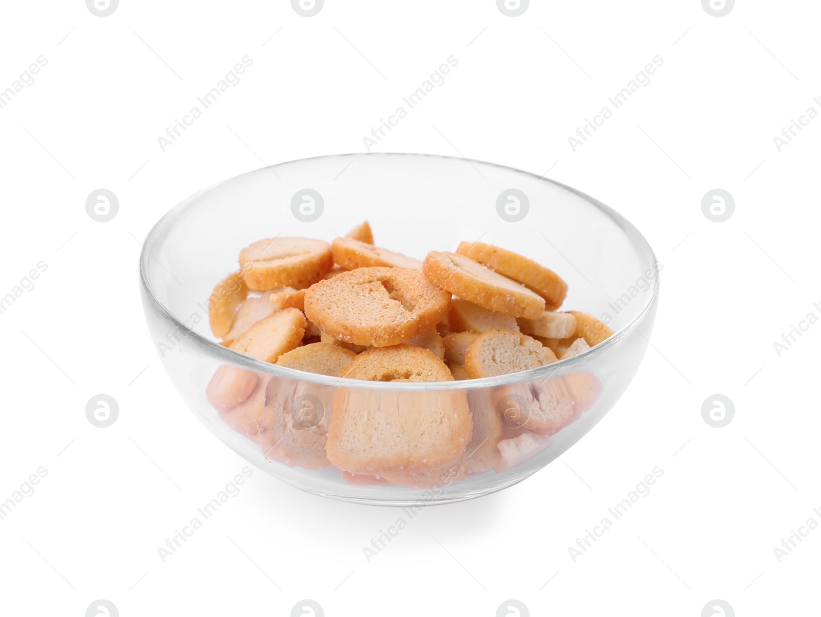 Photo of Delicious crispy rusks in glass bowl on white background