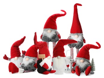 Image of Set with funny Christmas gnomes on white background 