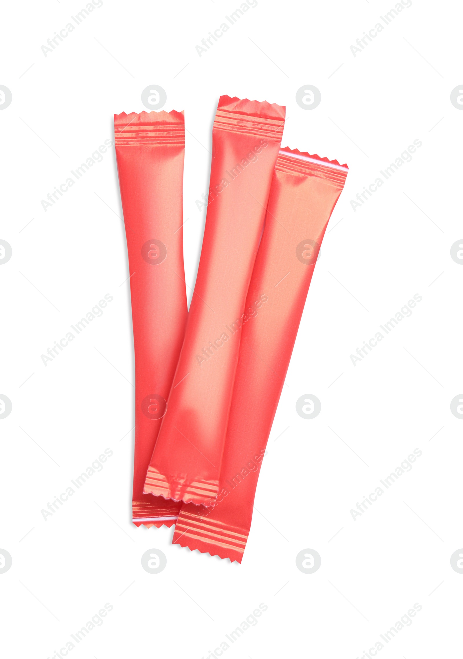 Photo of Red sticks of sugar on white background, top view