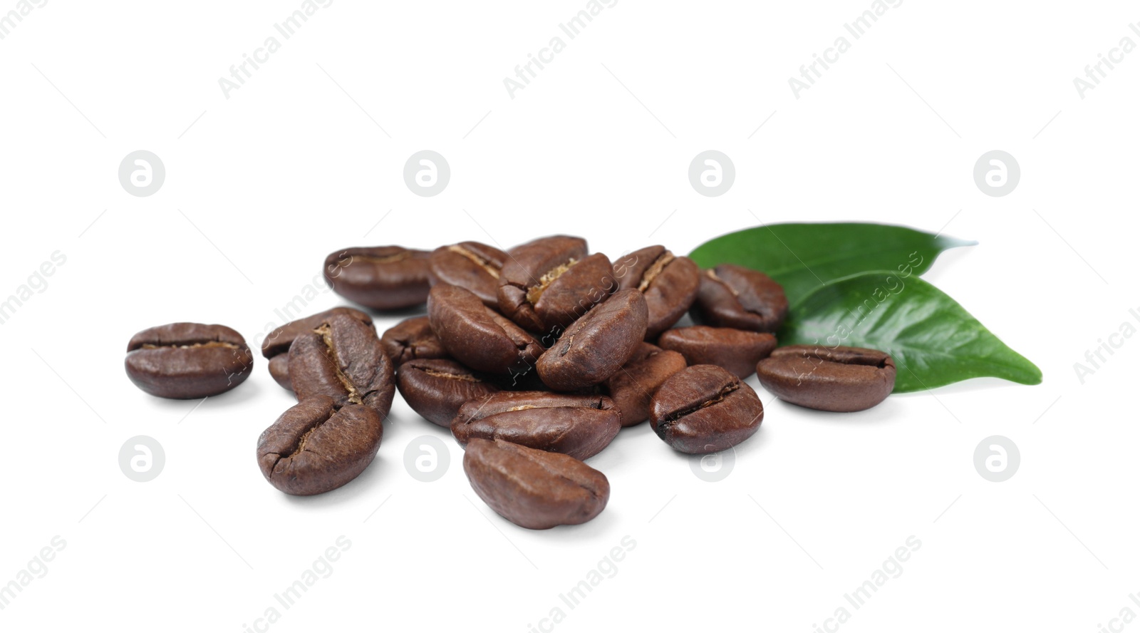 Photo of Pile of roasted coffee beans with fresh leaves on white background