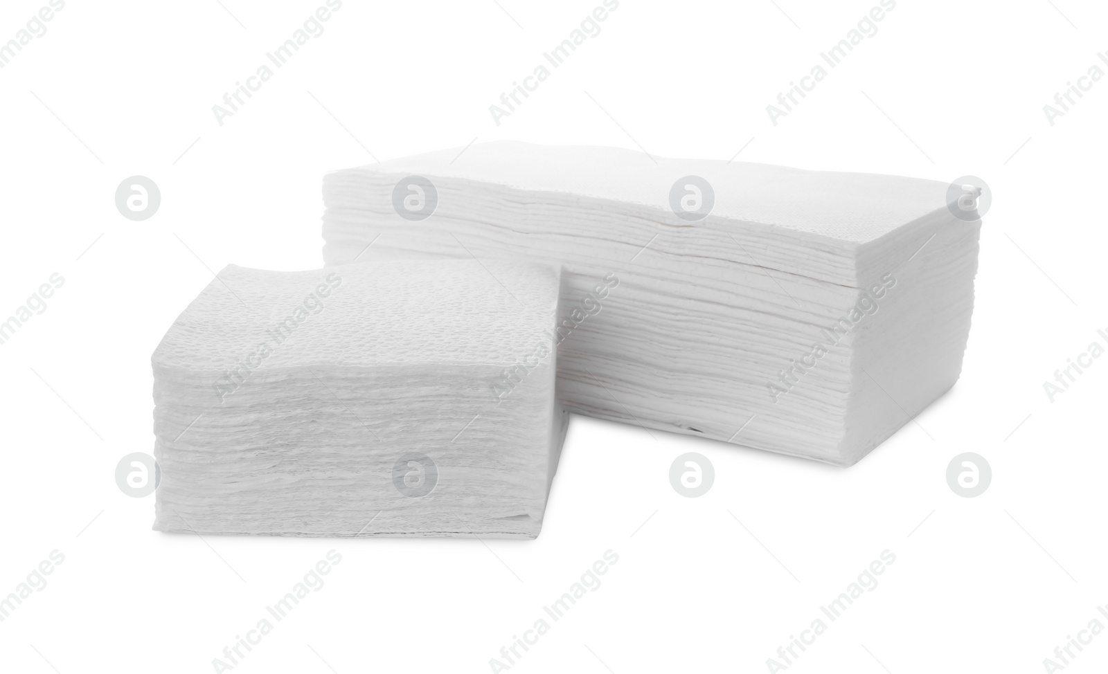 Photo of Stack of clean paper tissues and towels isolated on white