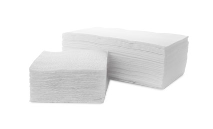 Photo of Stack of clean paper tissues and towels isolated on white