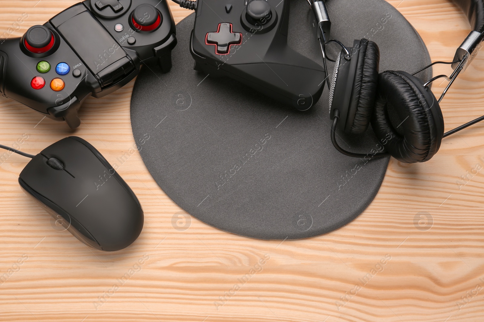 Photo of Composition with computer mouse and gaming gear on table