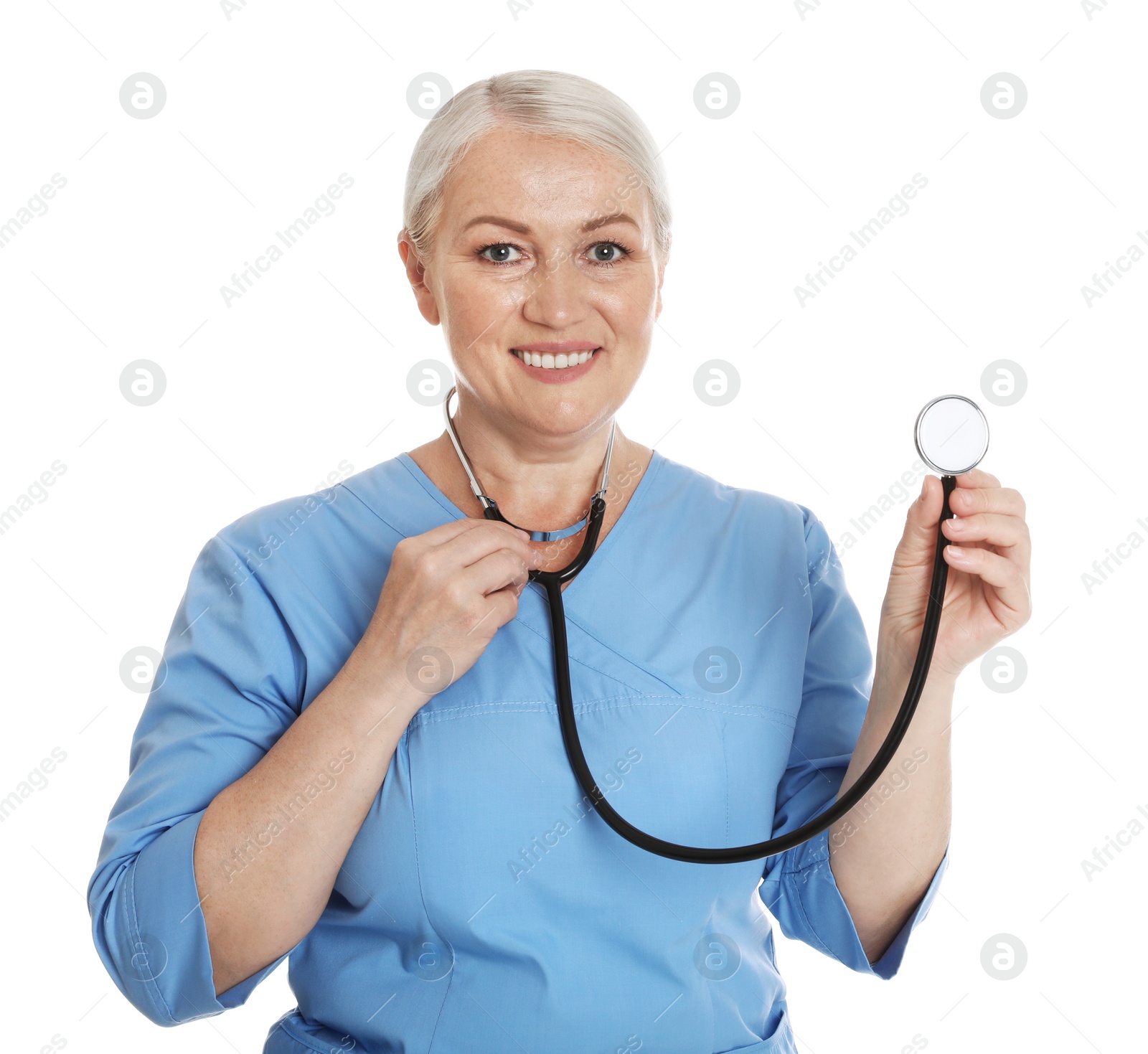 Photo of Portrait of female doctor in scrubs isolated on white. Medical staff