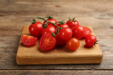 Fresh ripe cherry tomatoes on wooden table