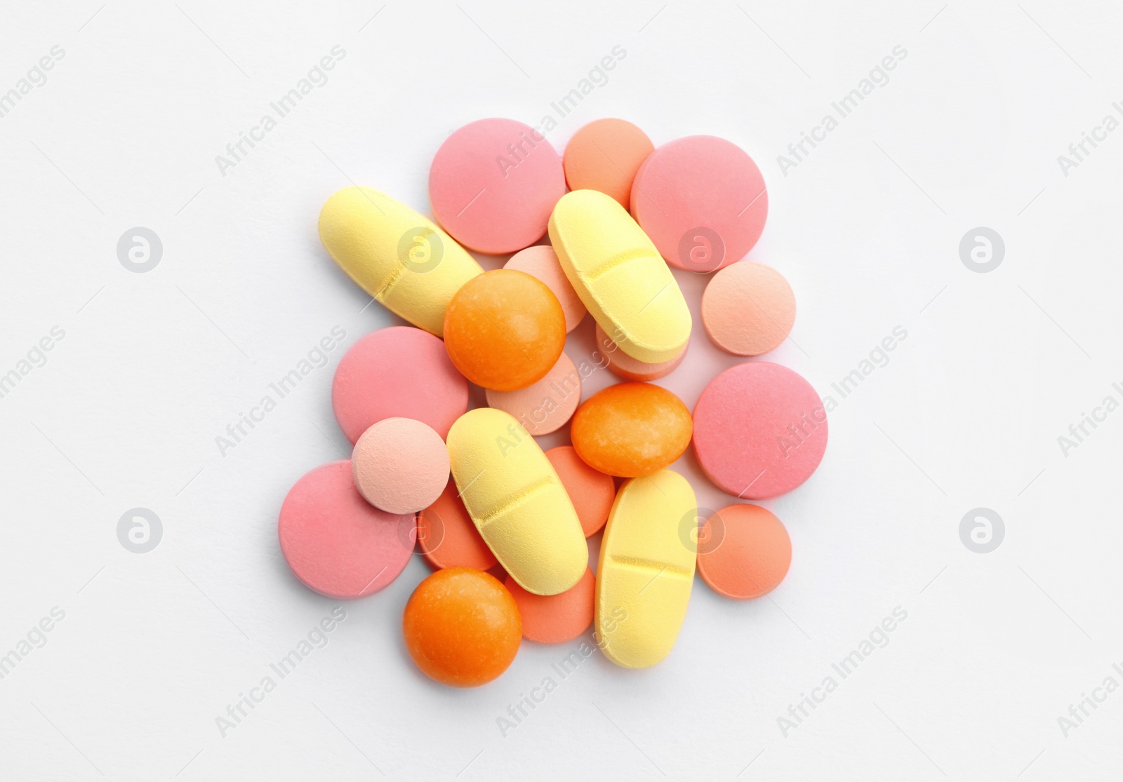 Photo of Different pills on white background, top view