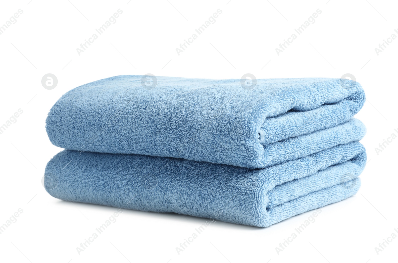 Photo of Folded clean soft towels on white background