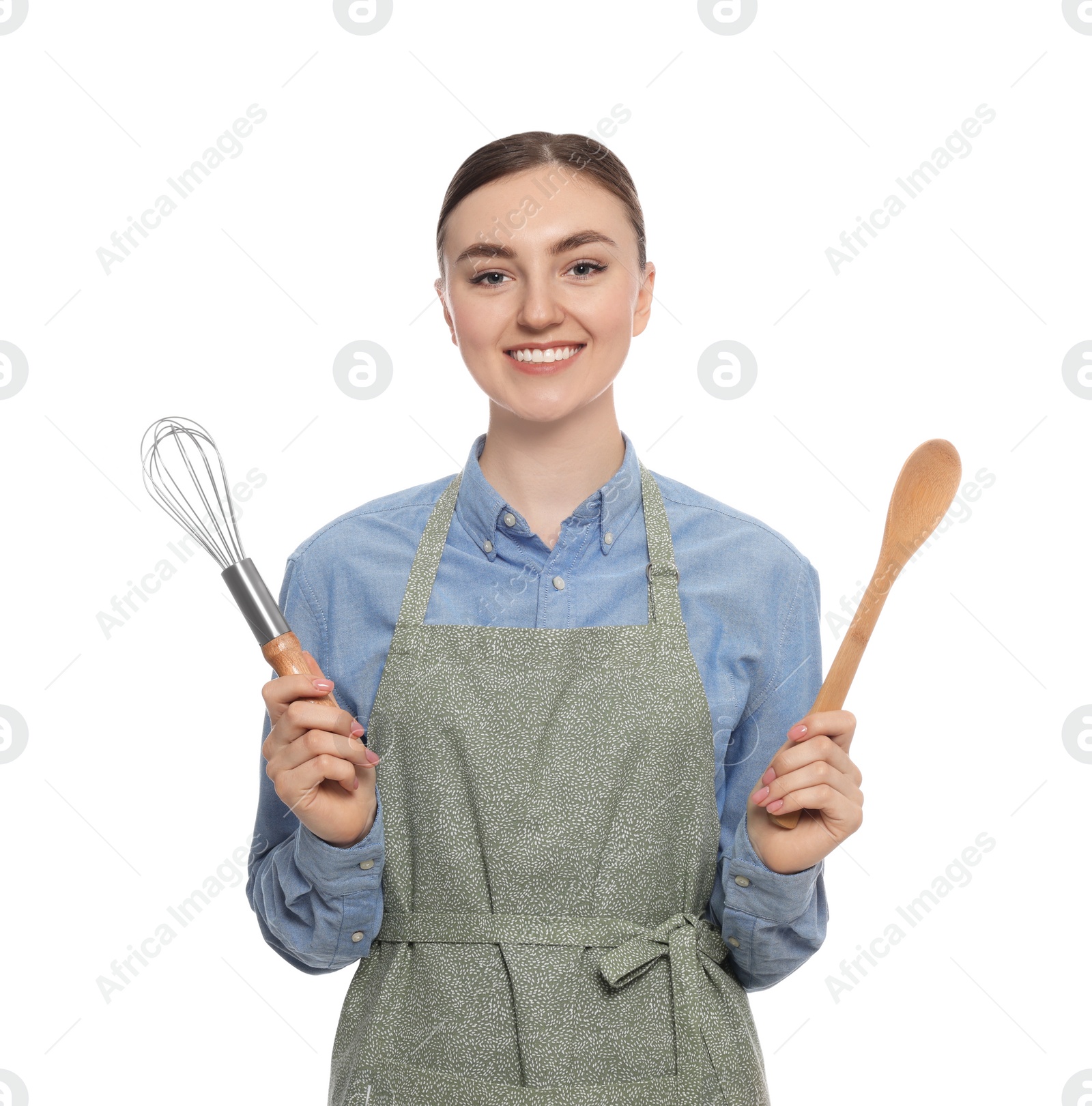 Photo of Beautiful young woman in clean apron with kitchen tools on white background