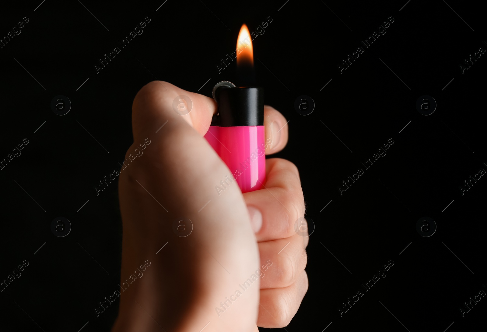 Photo of Woman holding pink lighter on black background, closeup