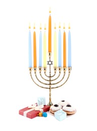 Photo of Hanukkah celebration. Menorah with candles, gift boxes, colorful dreidels and donuts isolated on white