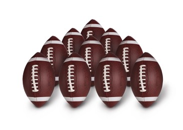 Image of Many leather American football balls on white background