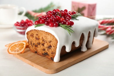 Photo of Traditional Christmas cake on white wooden table, closeup. Classic recipe