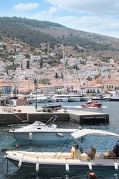 Beautiful view of coastal city with different boats on sunny day