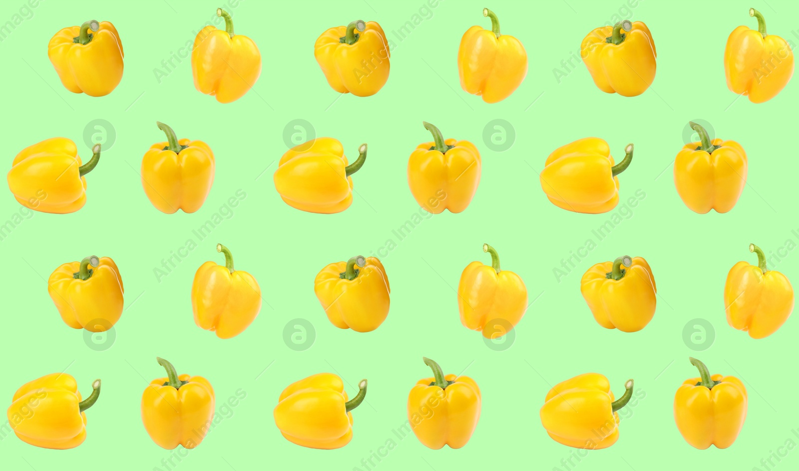 Image of Pattern of yellow bell peppers on light green background