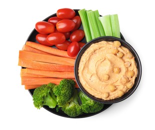 Plate with delicious hummus and fresh vegetables on white background, top view