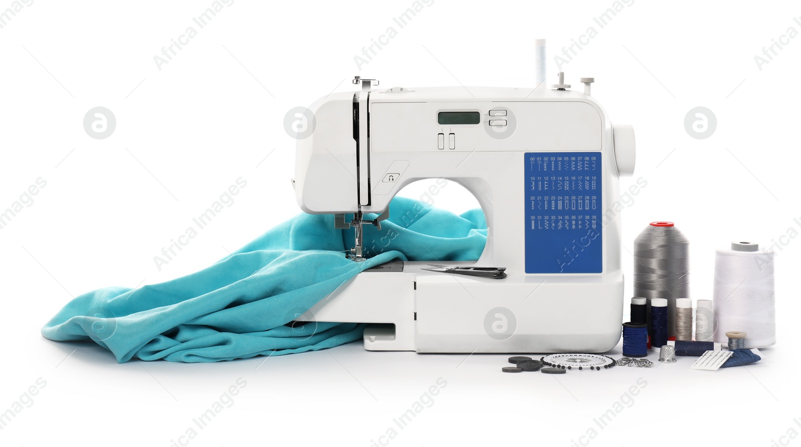 Photo of Sewing machine with fabric and craft accessories isolated on white