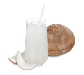 Photo of Glass of coconut water, ice cubes and nuts isolated on white