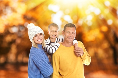 Image of Happy family spending time together at autumn park 