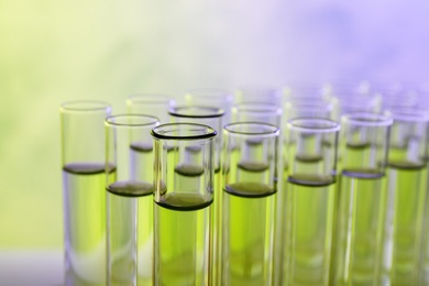 Closeup view of many test tubes with liquid, color tone effect