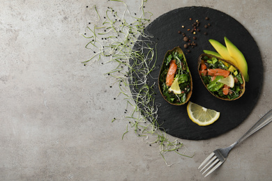 Photo of Delicious salmon with spinach served on grey table, flat lay. Space for text