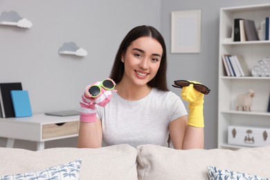 Happy woman performing puppet show at home