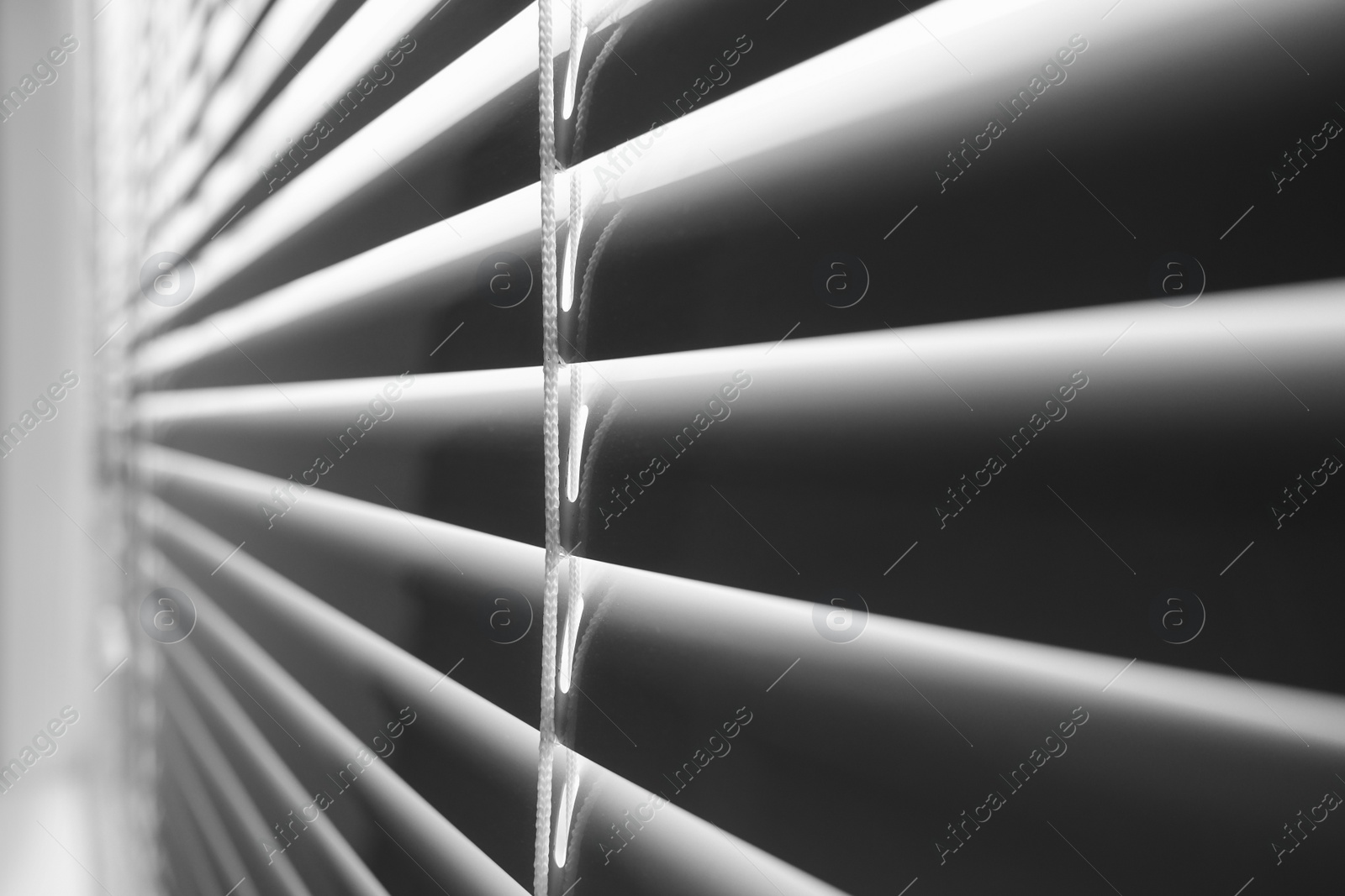 Photo of Closeup view of stylish horizontal window blinds